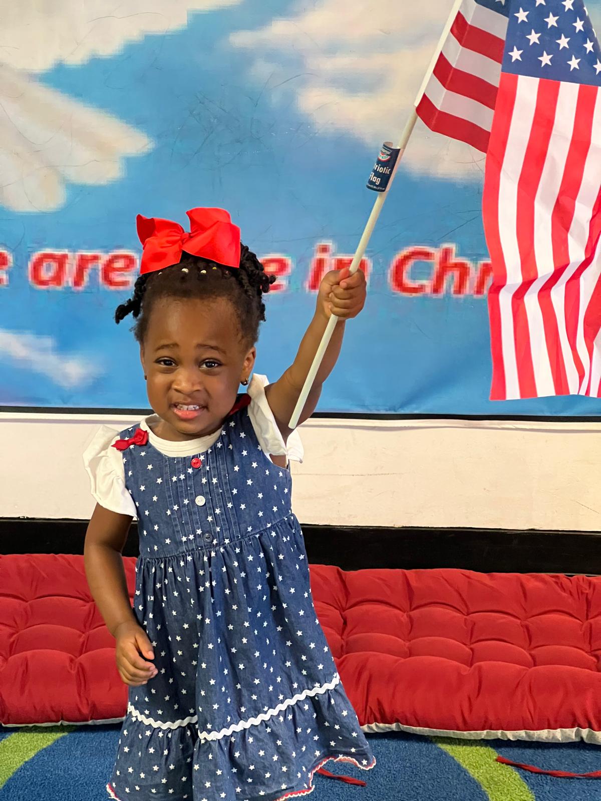 Christ Academy child participating in a patriotic activity