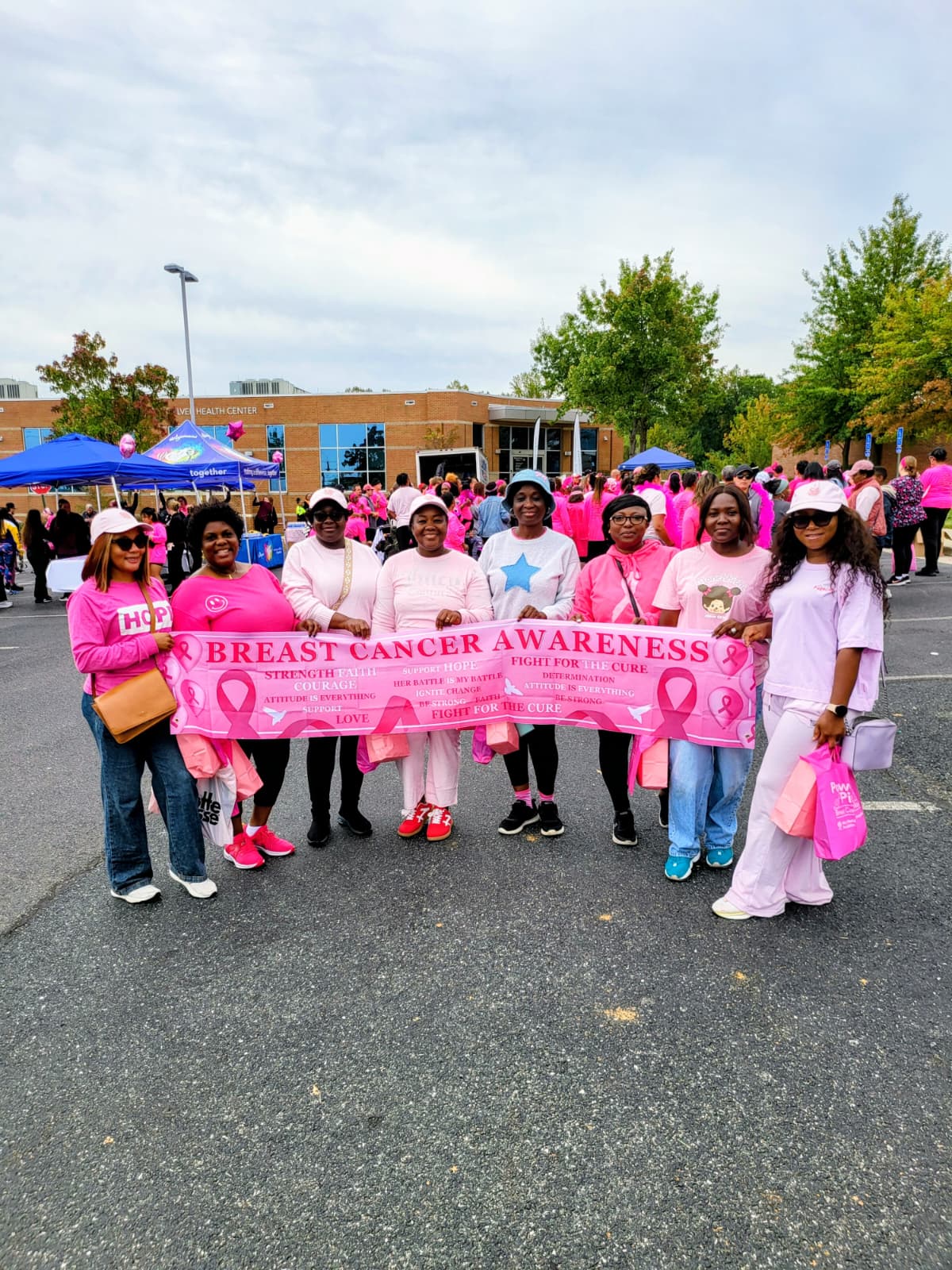 Church members supporting breast cancer awareness alongside the wider community